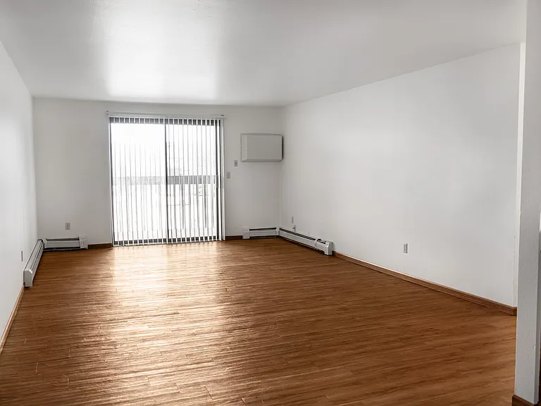 Step into the spacious living area of The Gallery, featuring natural light and elegant hardwood floors. This inviting space is perfect for your personal touch. Explore the options available and envision your new home today!