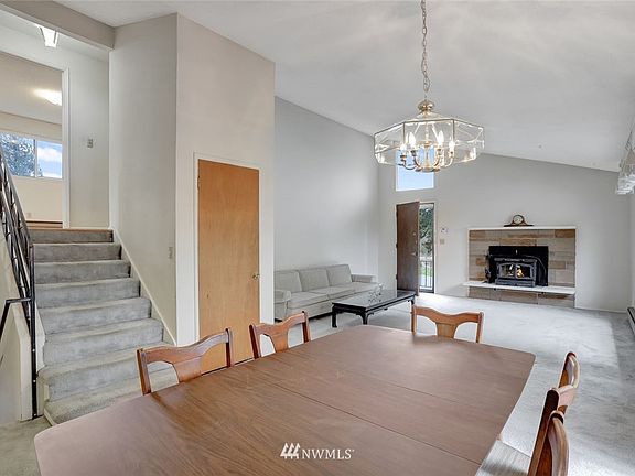 Upon entry, you're greeted with soaring, vaulted ceilings that accentuate the spaciousness of the living room and dining room!