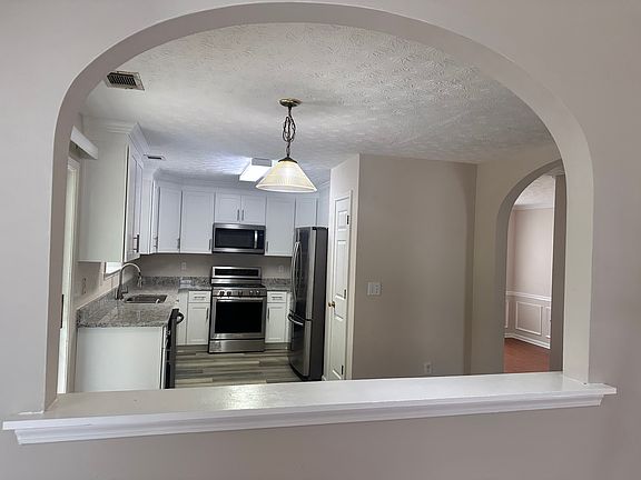 picture of kitchen from living room and breakfast area.