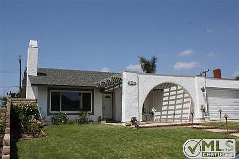 Roses trim the front yard.