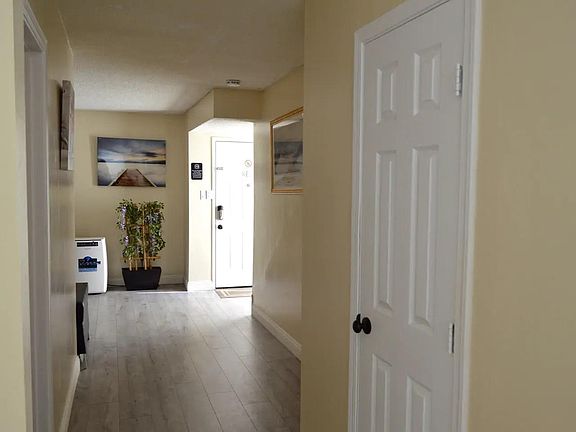 Hall Way opens to the dining area and kitchen