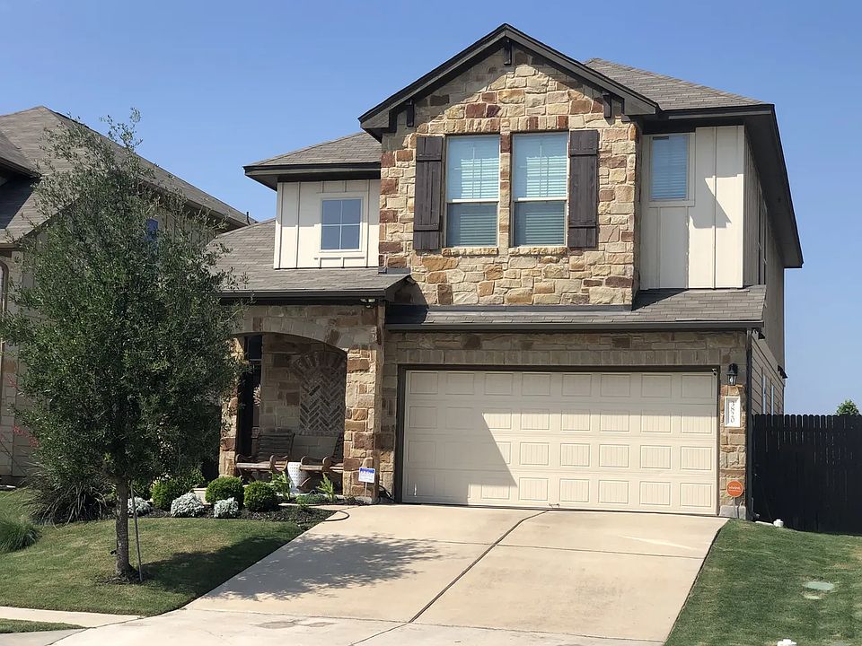 Front of home from the street view. Double gates on each side of home for access to back yard.