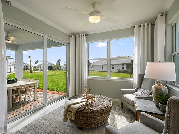 A bright sunroom makes for a cozy spot to enjoy your morning coffee. Model shown.