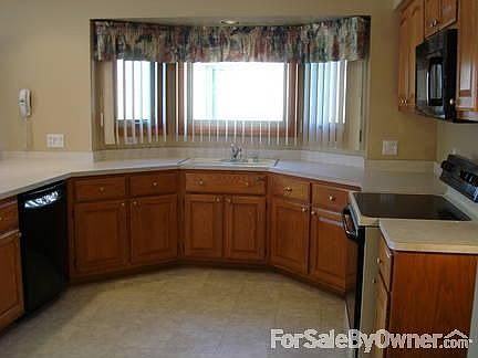 Kitchen with Custom Built Pantry
						:
						All appliances are included. Two cabinet pantries are by the refrigerator.