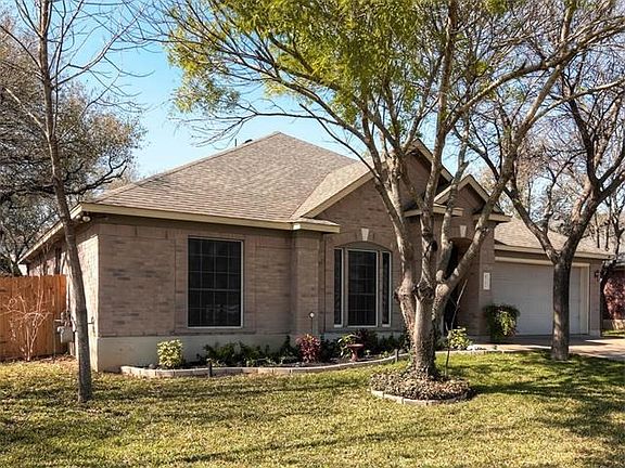 Mature trees will shade your home and lawn.  Sprinkler system covers front and back lawn.