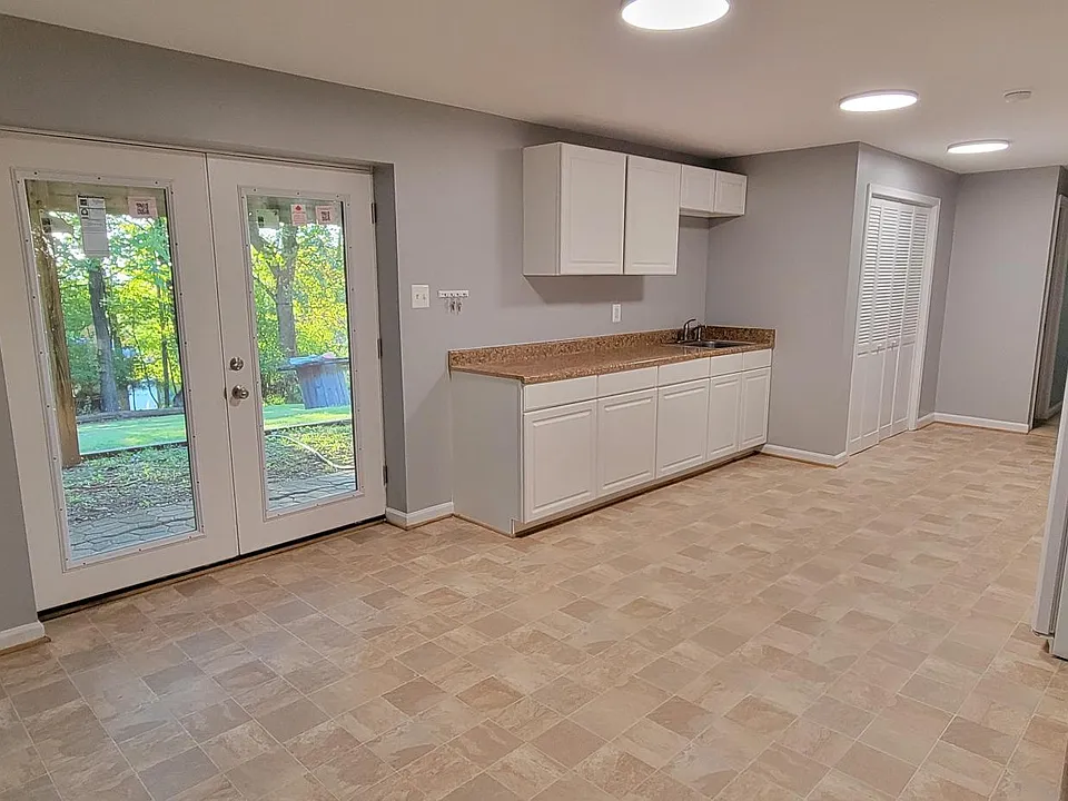 Private entrance with new french doors, opening into dining room and kitchen.