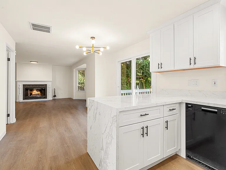 Seamless layout connecting the kitchen, eating area, and family room for functional everyday living.