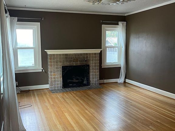 front door opens to large living room & gas log fireplace