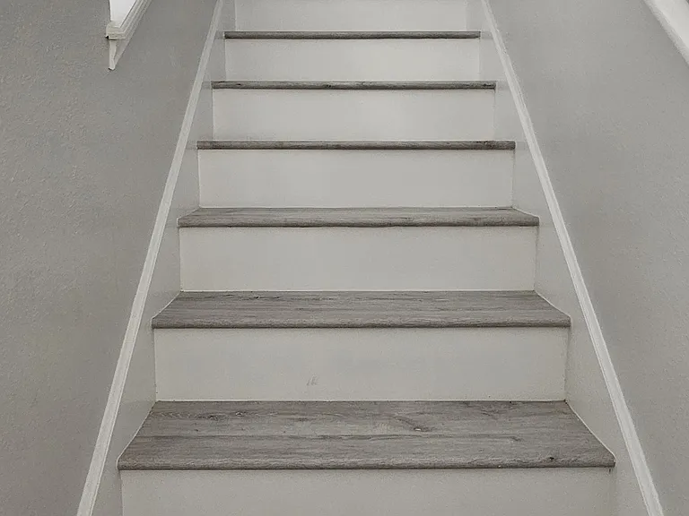 7.Staircase-up finished in thick solid wood, Upstairs landing and hallway in rich wood flooring