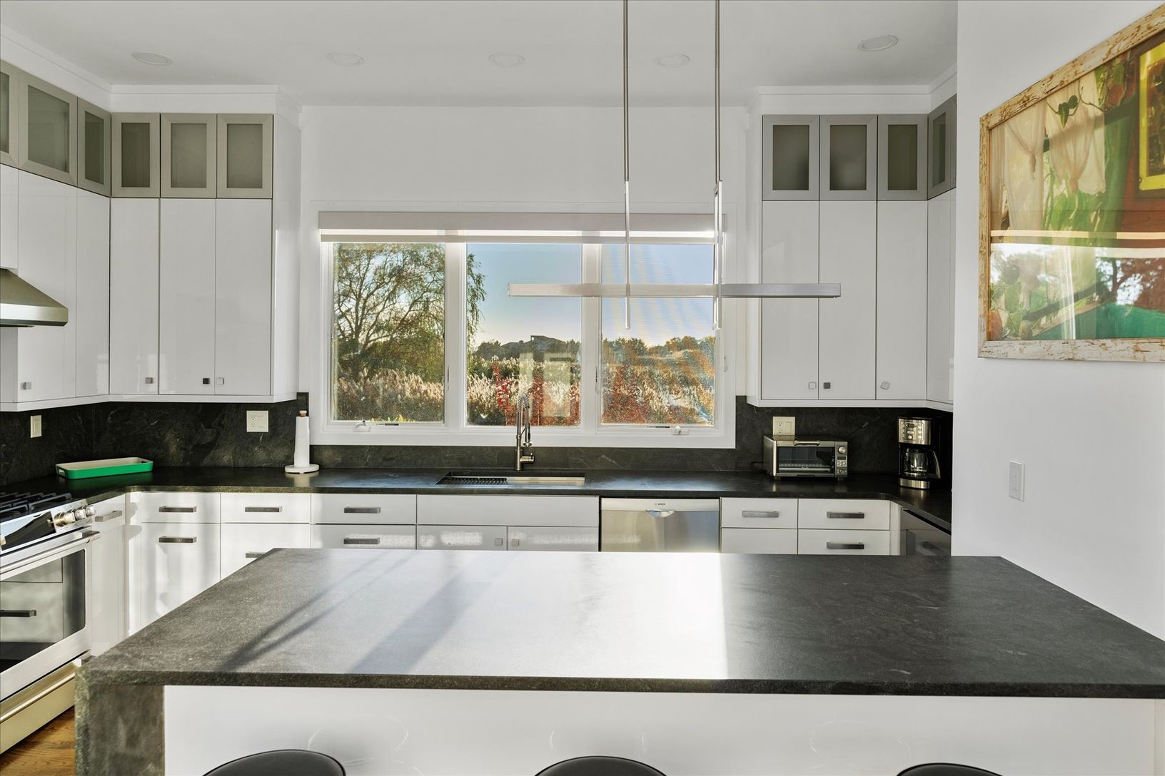  Gorgeous windowed kitchen with wine refrigerator and subtle lighting