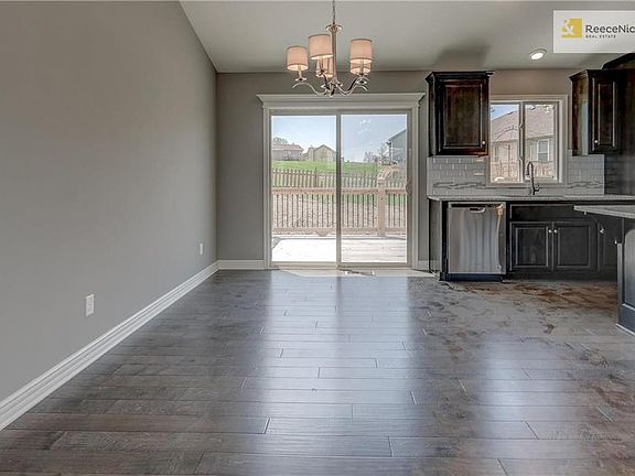 Prefinished wood flooring in kitchen, entry and breakfast. Sliding glass door leads out to spacious deck.