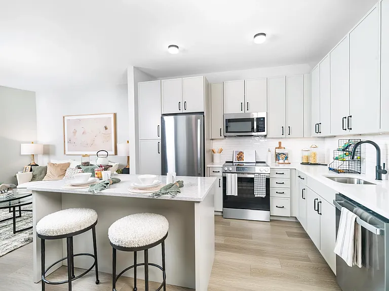 Clean lines, bright finishes, and an intuitive layout make this kitchen the heart of your home_perfect for quiet mornings or casual entertaining.