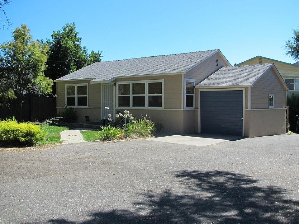 Front of cottage and attached garage