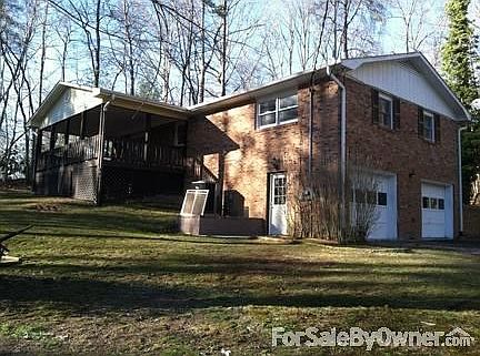 Rear of house from Fallen Timbers Drive
						:
						Deck overlooks relatively deep lot, which is .74 acres.
