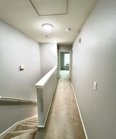 Hallway to secondary bedroom