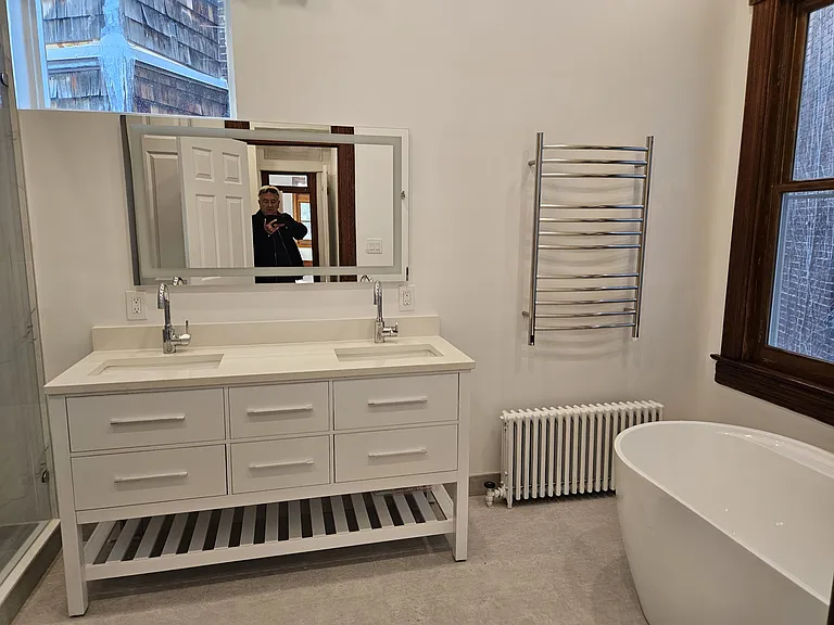 2nd floor suite, bathroom with free standing tub, double vanity and towel warmer.