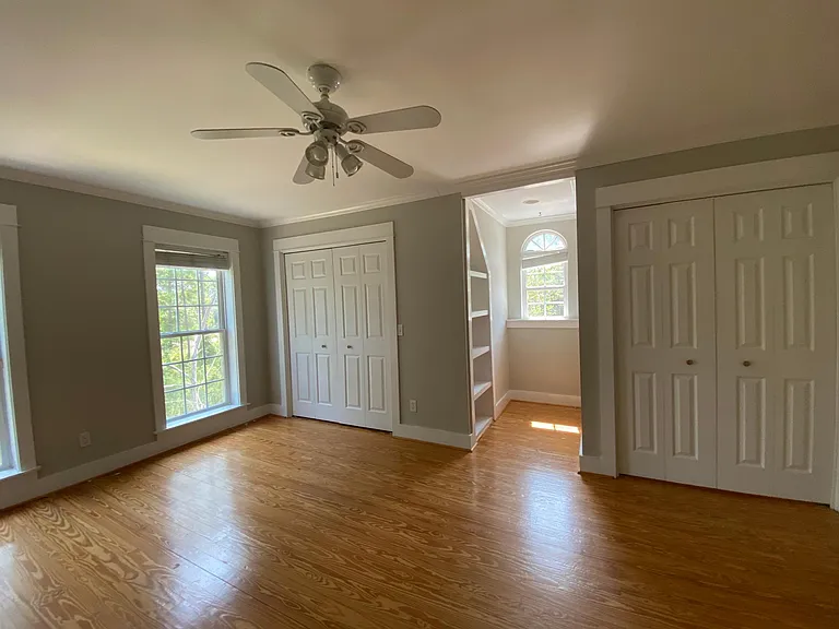 Two large closets in the bedroom, with built in book shelves and reading nook.