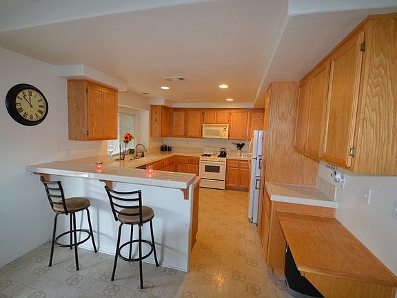 Family kitchen opens to the breakfast nook and family room.