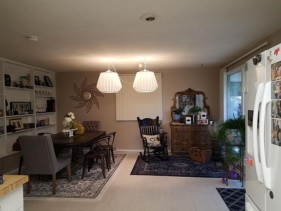 Eat in kitchen dining space with built-in book shelves and f