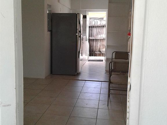 View from Living Room through kitchen to Private Patio