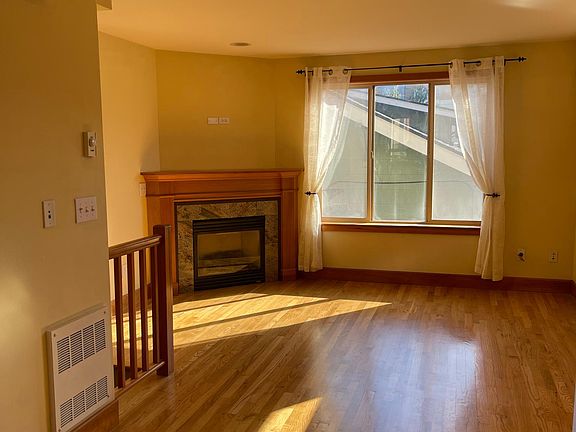 light filled family room, hardwood floors, gas fireplace