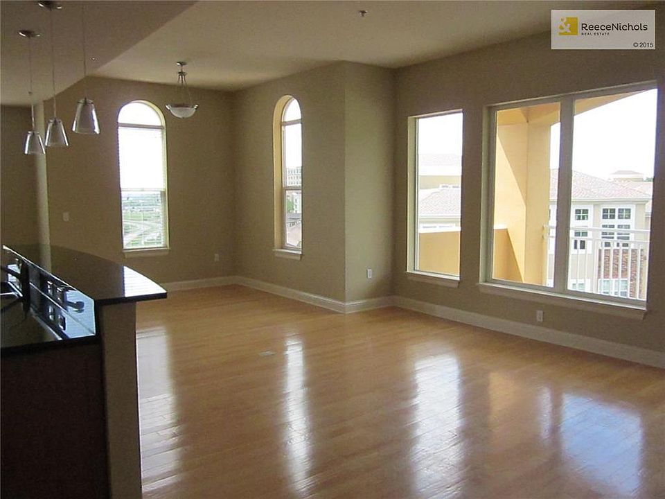 Living room looking to sitting room and Balcony