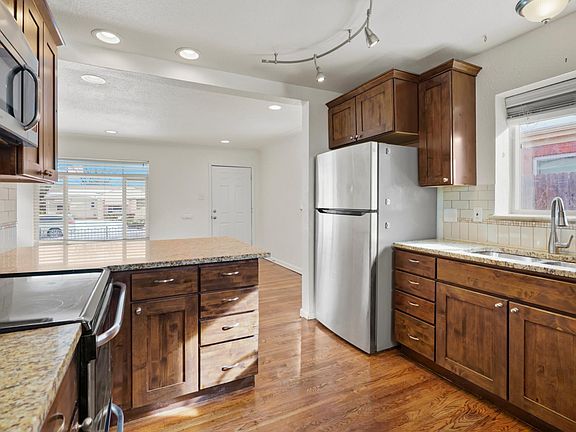 Modern, open kitchen with plenty of counter space and natural light.