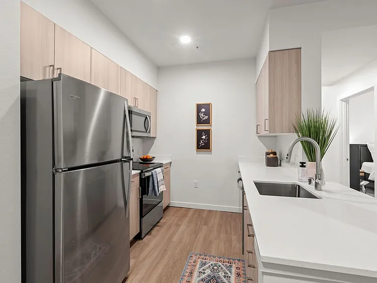 Experience breathtaking kitchens adorned with quartz countertops and tailor-made cabinetry.