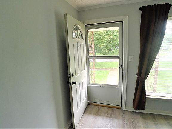 Come In! Newer front door & front door storm.