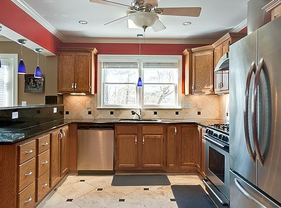 Granite, New Cabinets, Stainless Appliances, Travertine Floors