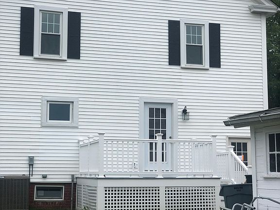 back entrance to house with deck