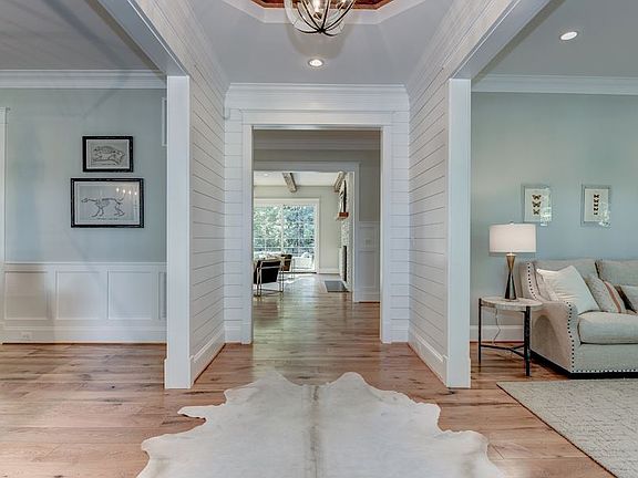 Shiplap accent walls, reclaimed wood tray ceiling