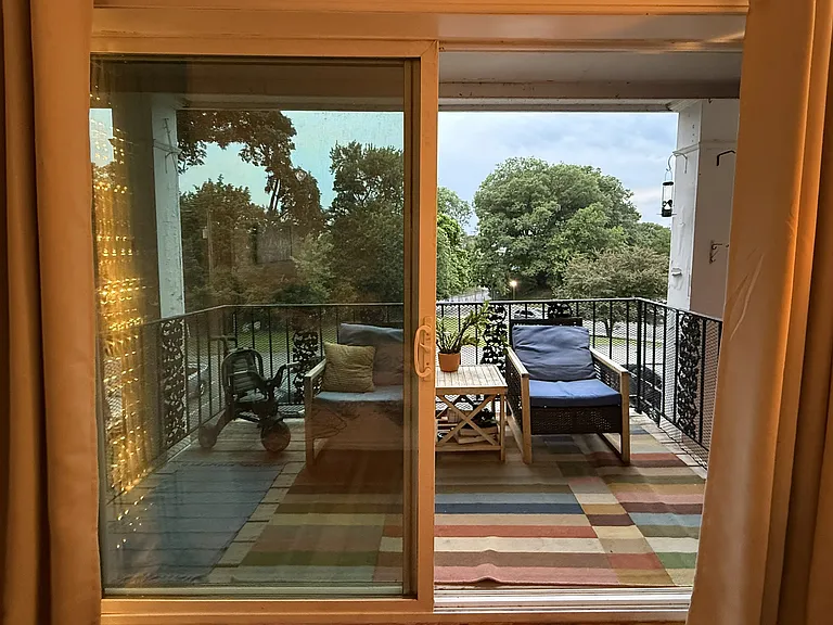 cozy porch with view of Hudson River when the trees are bare, only balcony with a roof