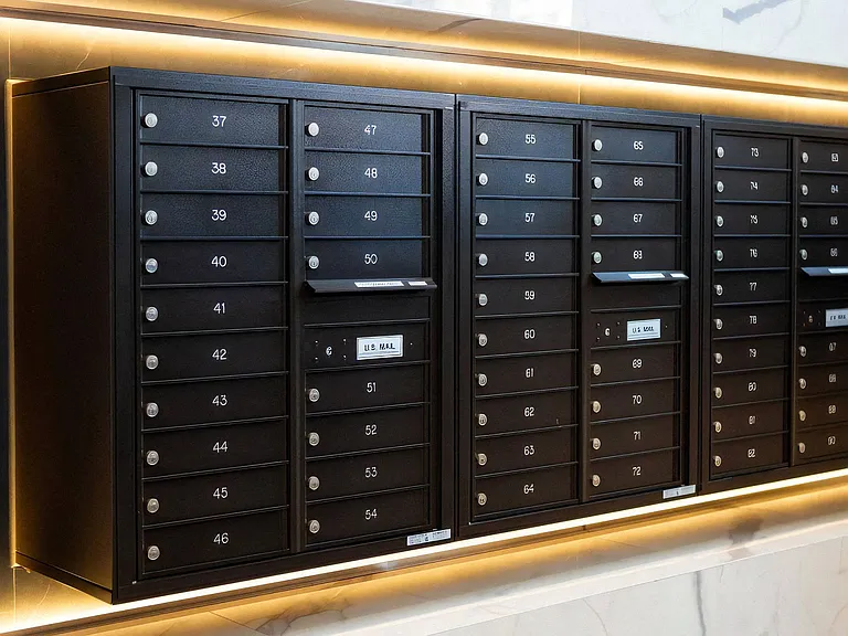 Resident Mail Center Featuring Numbered Mailboxes and Drop Slots