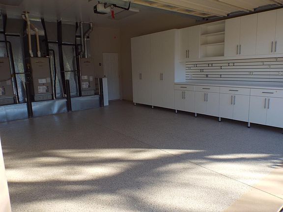 Finished Garage With Built In Cabinetry