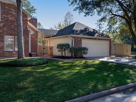 The detached garage has a covered walkway which leads directly to the laundry and kitchen.