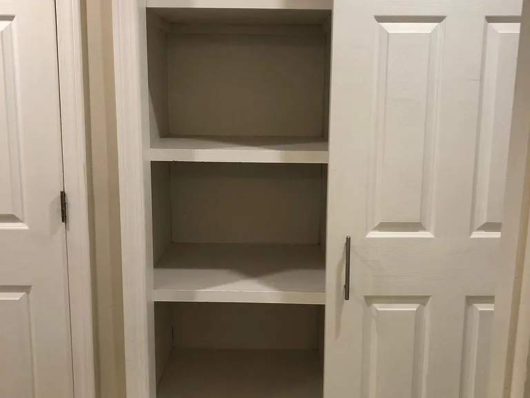 Linen closet across from bathroom