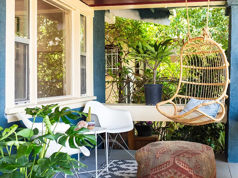 Large front porch for furniture.