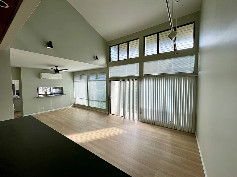Living room with Mitsubishi split AC. Has 15ft+ ceilings.