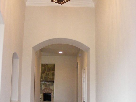 Rich hardwood floors greet you at the entrance of this home.