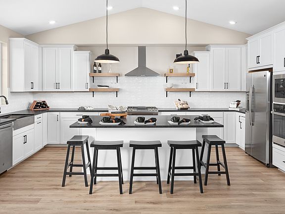 Kitchen with black pendant lighting