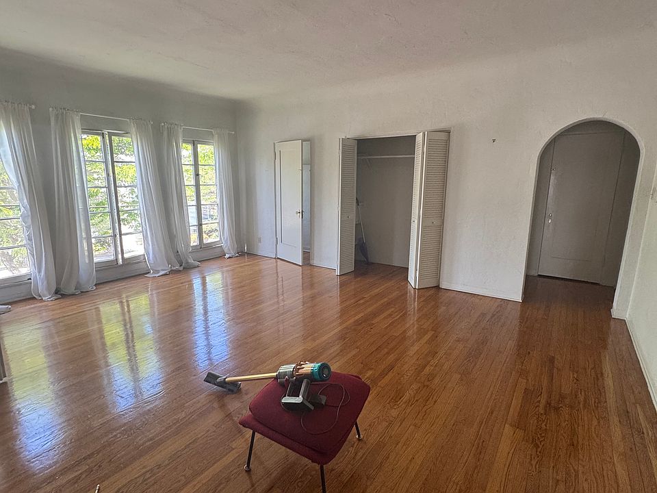 Living room so large it has two entrances from the hallway. Large French Windows face the street providing natural light