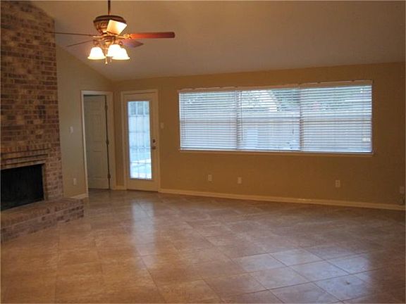 This is a view of the family room with 20" ceramic tile floors for easy cleanup. The ceiling fan is 