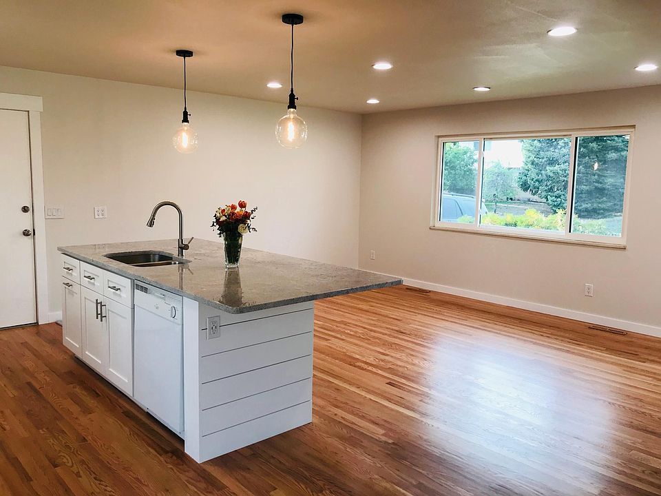 Living room and kitchen island with bar seating for 6 adults!