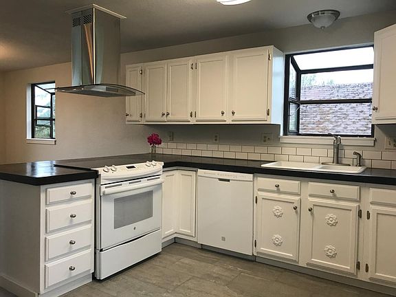 Kitchen w/ range and dishwasher