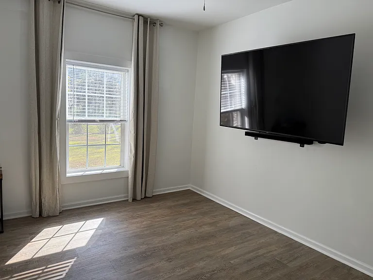 Living area with entry from fenced yard