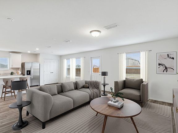 Bright and inviting gathering room perfect for entertaining Model representation