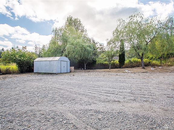 Back parking area. Ideal location to build a shop!