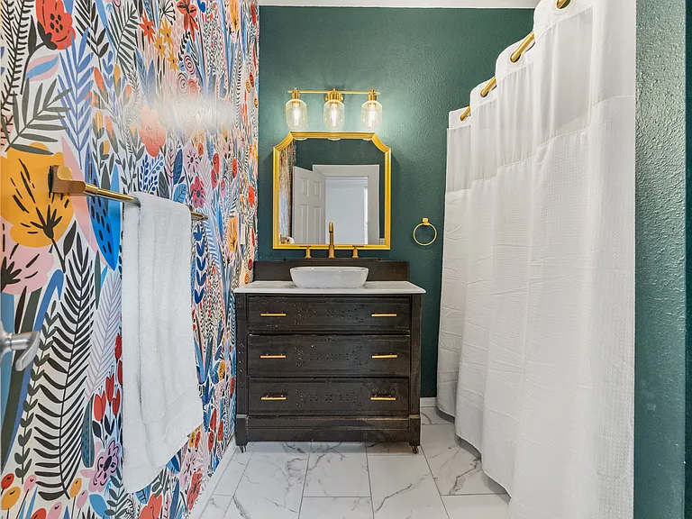 Thoughtfully designed bathroom with unique character and modern updates.