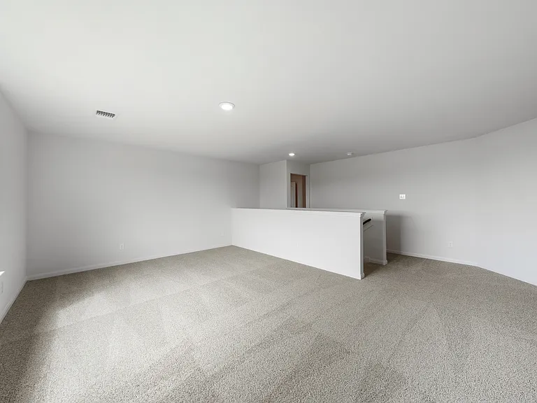 The spacious upstairs loft is the perfect space for a gameroom or craft room.
